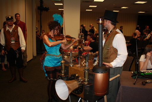 A steam-powered music box, and a violinist